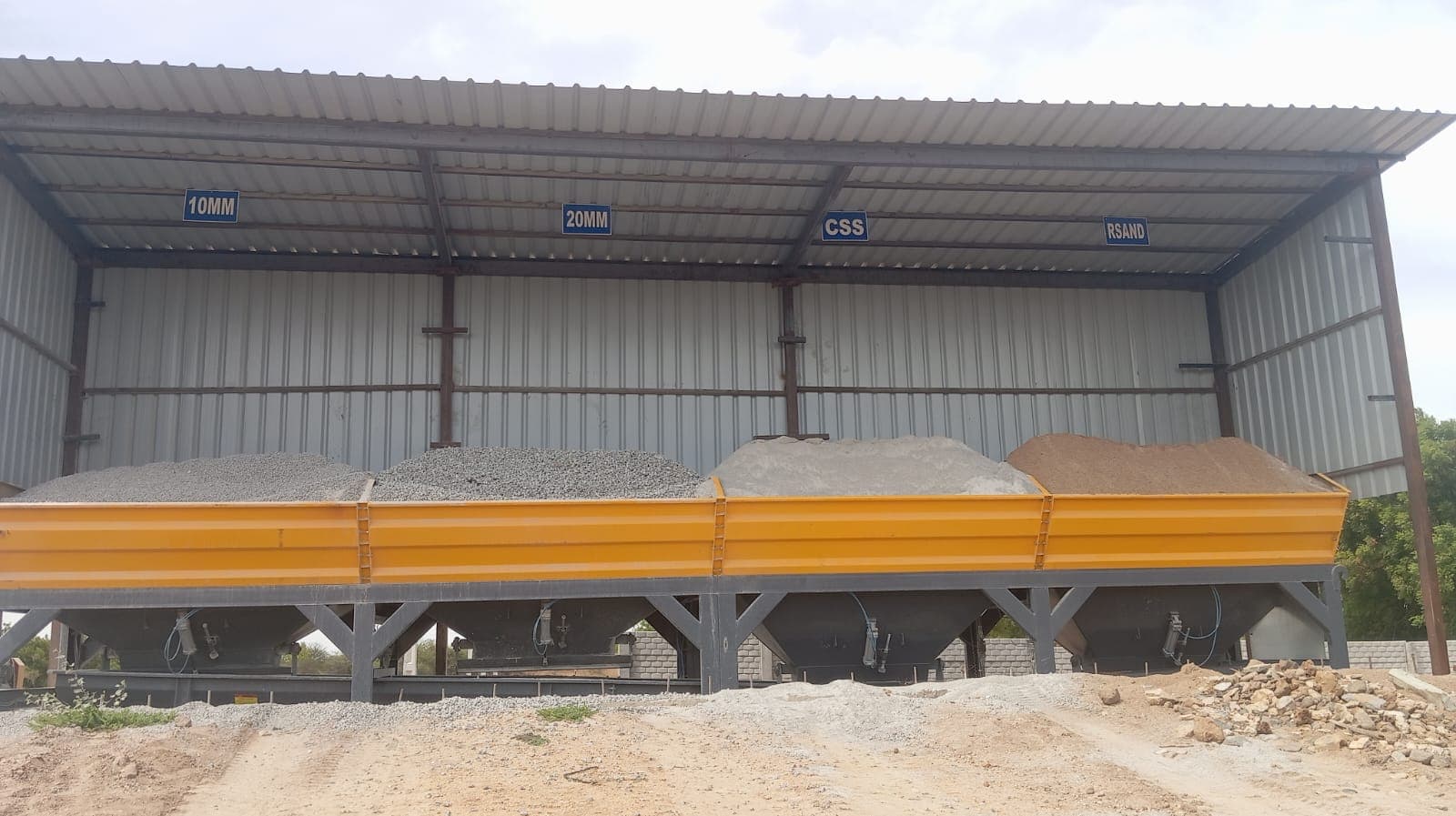 Labeled aggregate hoppers for 10MM, 20MM, CSS, and river sand