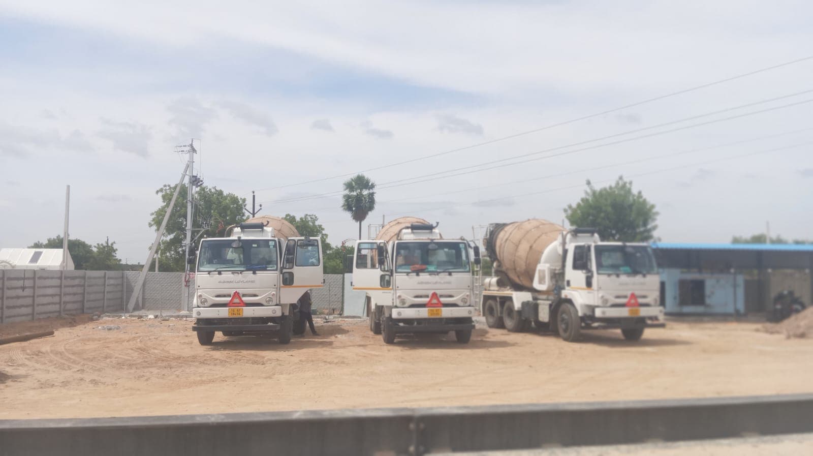 Ashok Leyland transit mixer trucks lined up and ready for site delivery